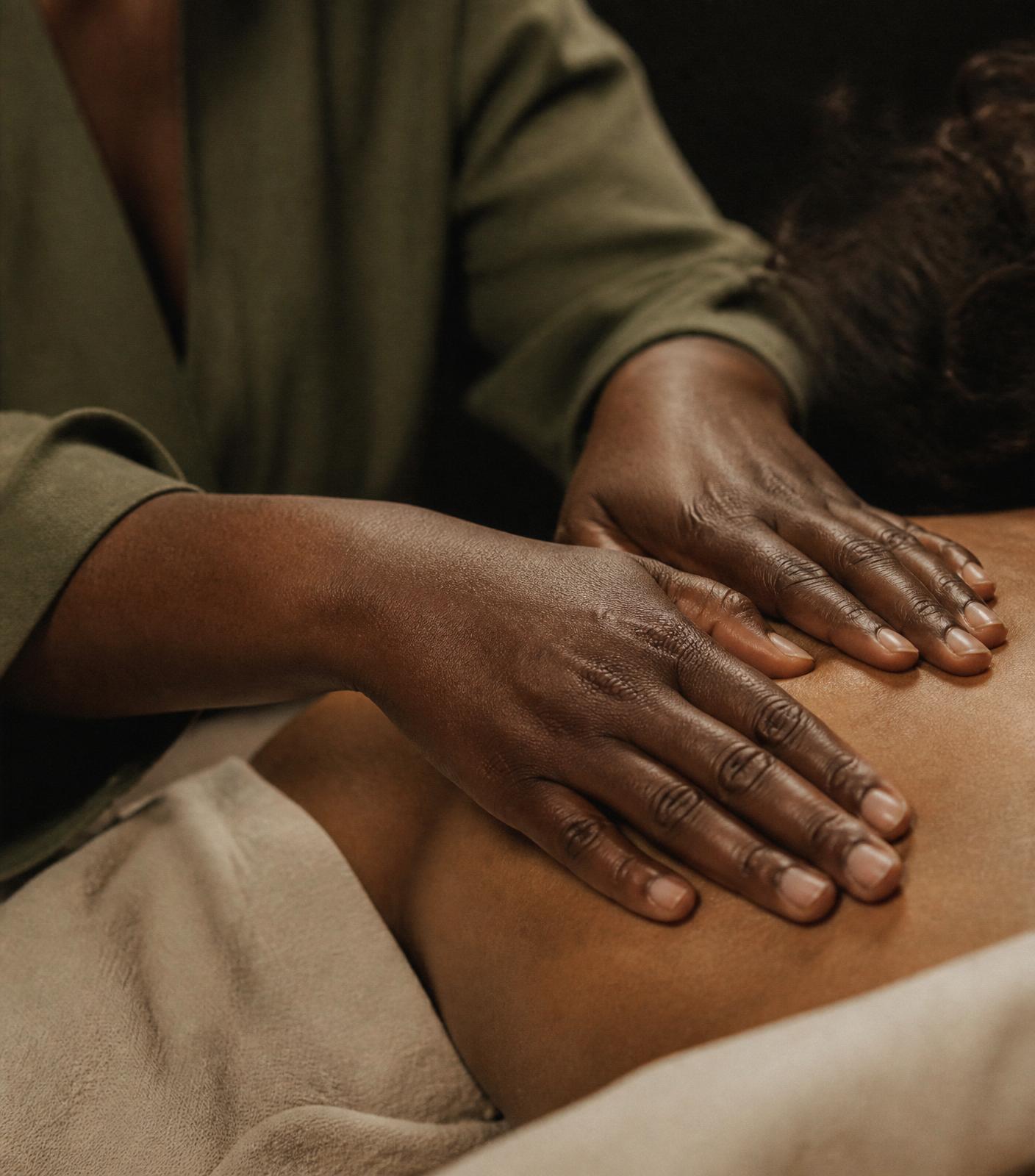 Practitioner's hands during a professional bodywork session